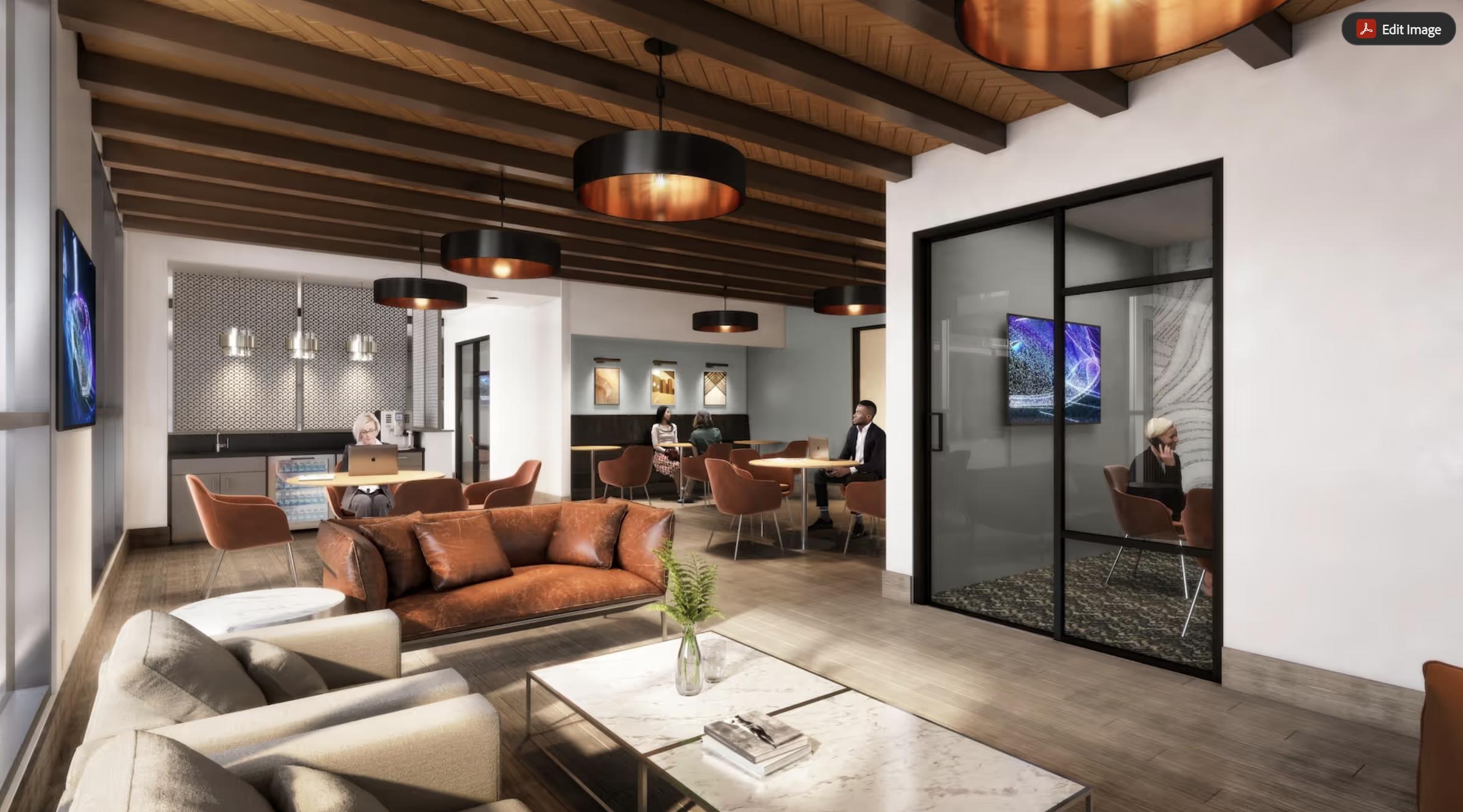 Modern office lounge with brown sofas, glass meeting room, people working, and stylish pendant lights and wood ceiling beams.