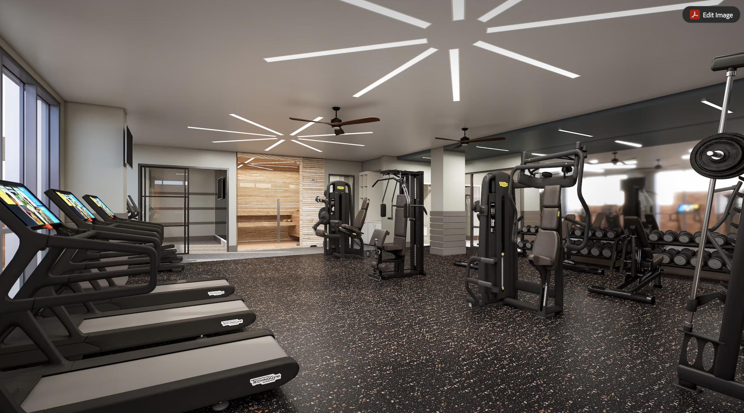 Modern gym with treadmills, weight machines, free weights, mirrors, and bright ceiling lights. Sauna visible through glass door.